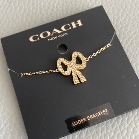 COACH Gold Tone CZ Pave Bow Slider Bracelet